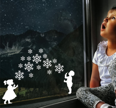 Boy And Girl Blowing Snowflakes - Christmas Wall / Window Sticker